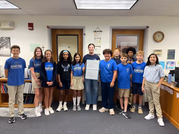 Students celebrating classroom achievement